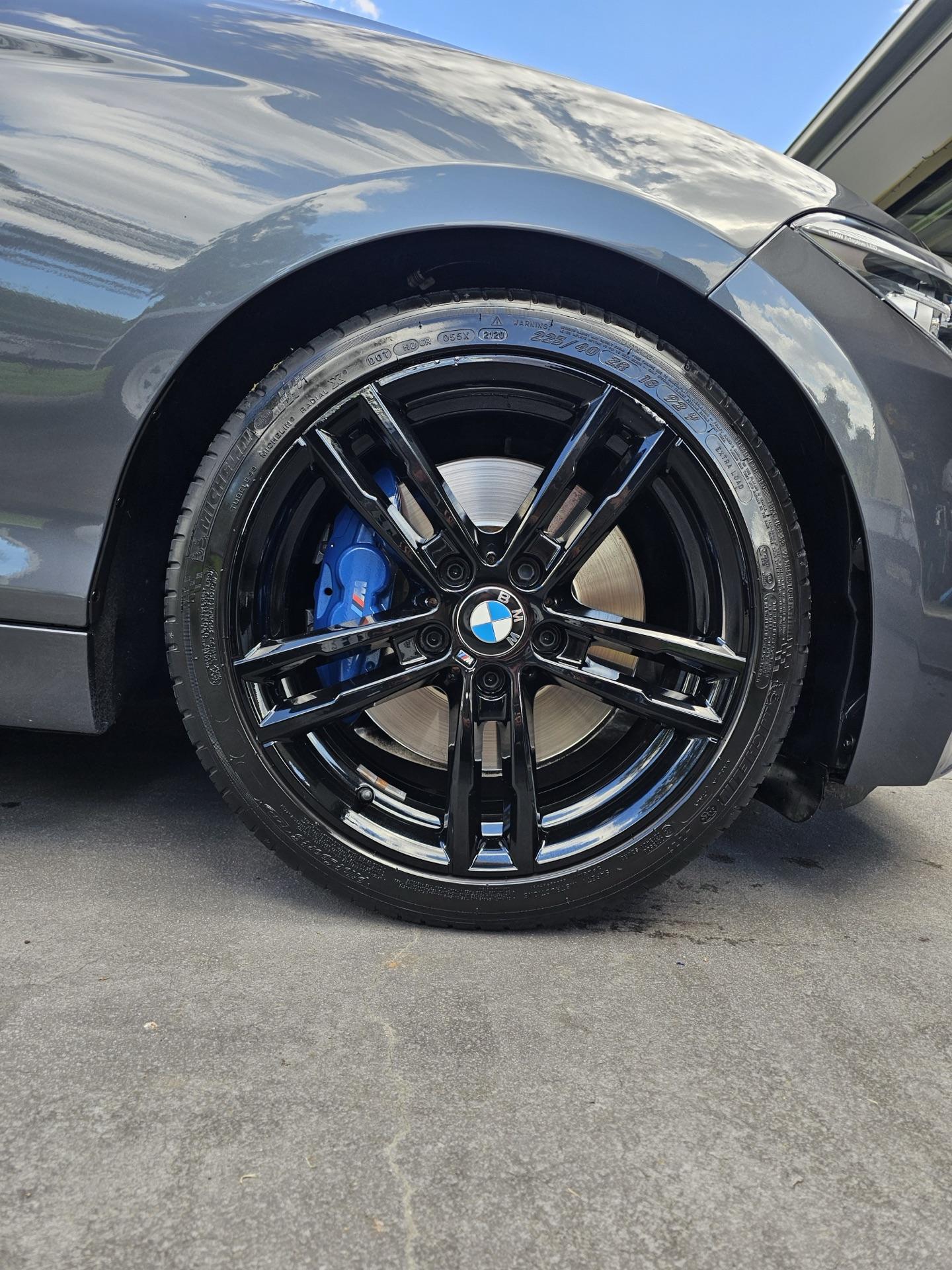 BMW alloy wheel with M-sport caliper after detail